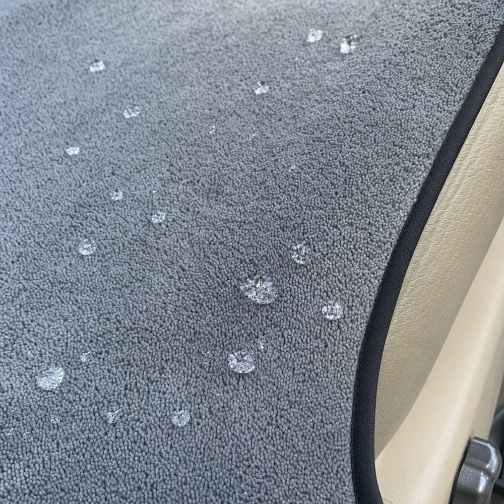 Close-up of the plush microfibre towelling and black piped edge