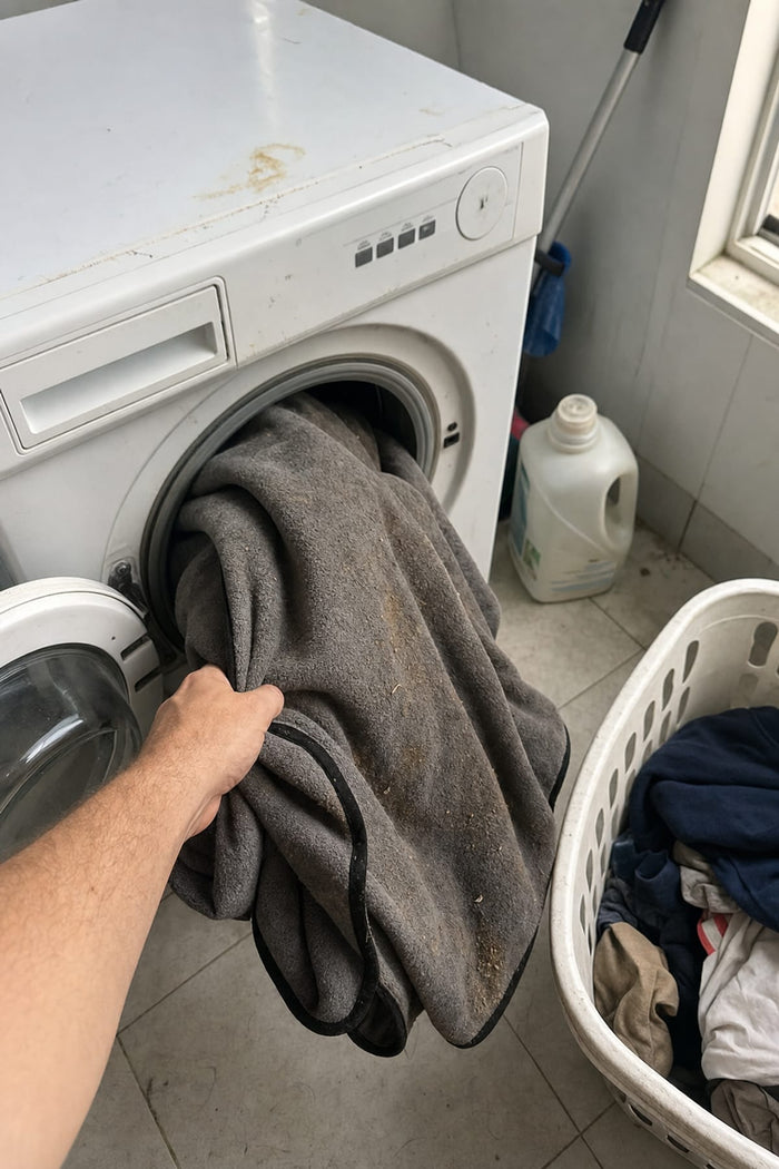 Putting the seat towel in the washing machine